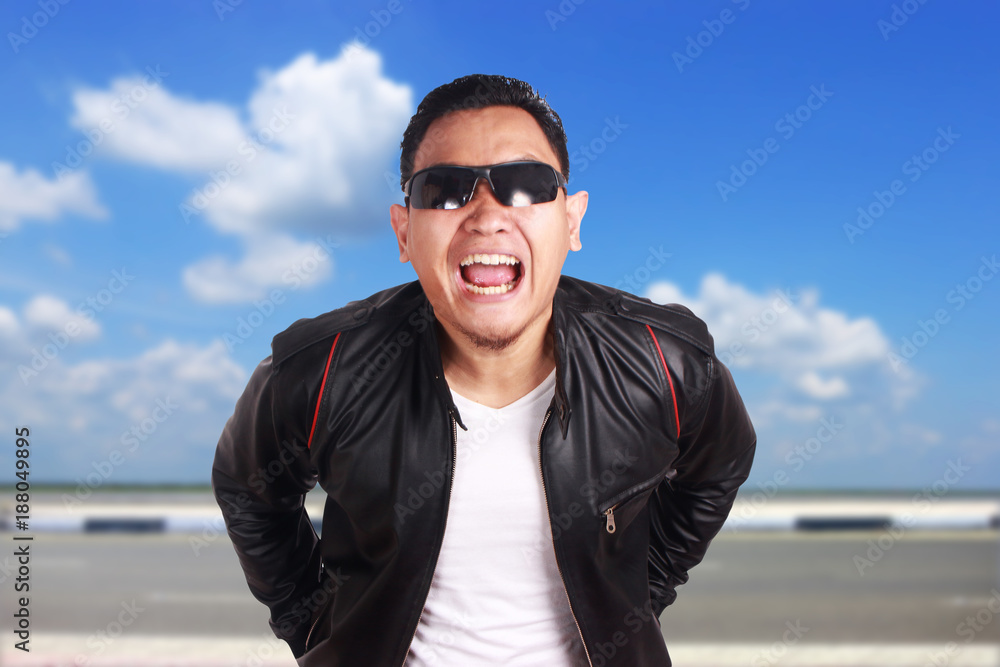 Asian Man in Black Leather Jacket Laughing Asian Man in Black Leather Jacket Laughing