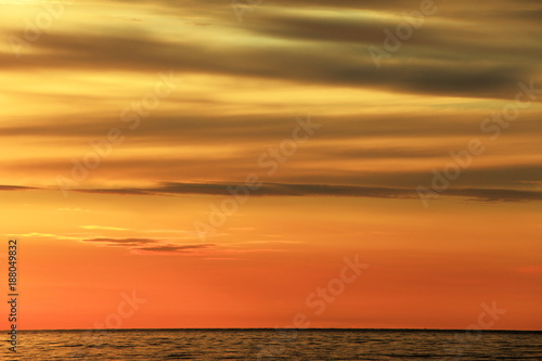 Colorful sunset over the Baltic Sea shore and beach in Rowy, Poland
