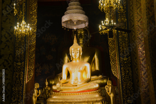 Two sculptures of a seated Buddha in a vihan of a Buddhist temple Wat Bovornniwet Wihan. Bangkok, Thailand photo