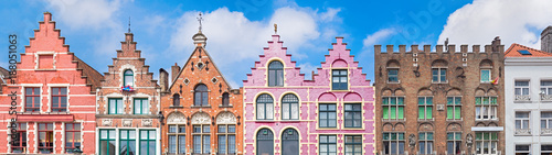 Traditional colorful Belgian facades of houses at Market square in city of Bruges. photo