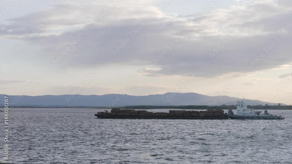 barge with wood on the Amur River barge with wood on the Amur River