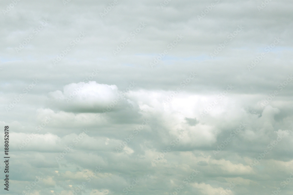 thick Puffy gray-white cloud over the island in a tropical country day. thick Puffy gray-white cloud over the island in a tropical country day.