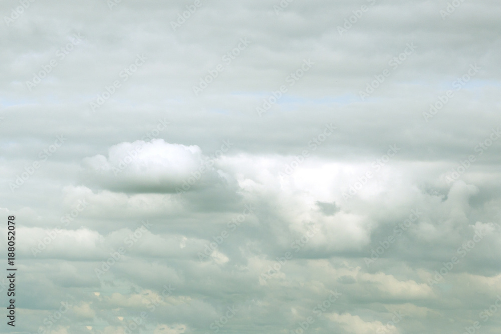 thick Puffy gray-white cloud over the island in a tropical country day.