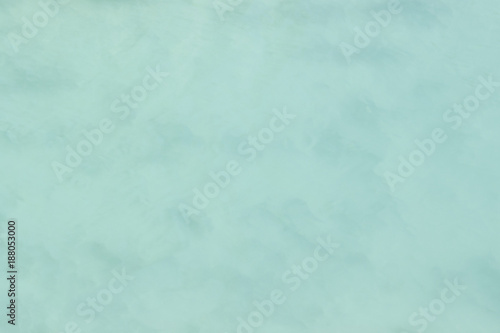 A background abstraction of water motion mixed with clouds and fog. Image displays a pleasing paper grain and texture when viewed at 100 .