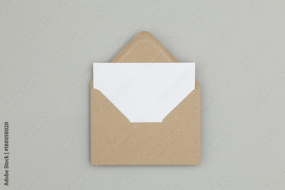 Blank white card with kraft brown paper envelope template mock up - obrazy, fototapety, plakaty 