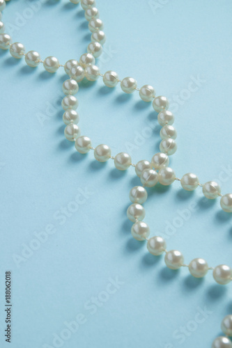 Abstract background of luxury DNA made out of white pearls on blue background with space for text