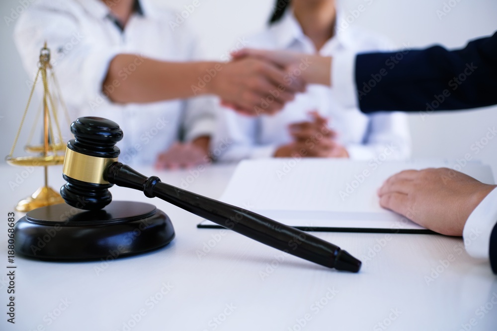 Female lawyer handshake with client. Business partnership meeting successful concept. Female lawyer handshake with client. Business partnership meeting successful concept.