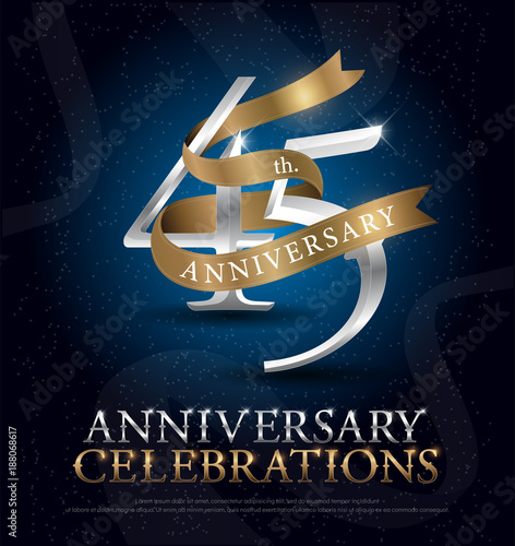 45th years anniversary celebration silver and gold logo with golden ribbon on dark blue background. vector illustrator photo