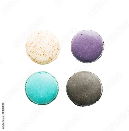 Flat lay top view four Colorful macarons on white background. Minimal pattern, creative dessert concept