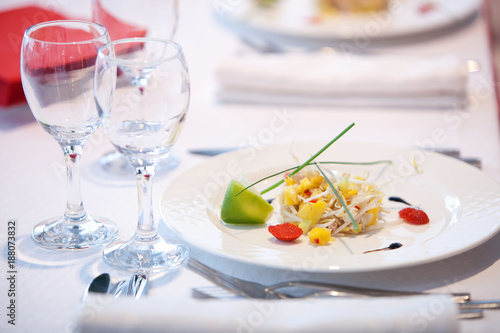 Served table in the restaurant with glasses, napkins and cutlery