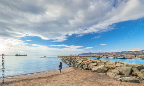 Colorful morning at sandy beach of Eilat - famous resort and recreation city ...