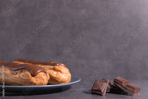 Homemade eclair on a stone table