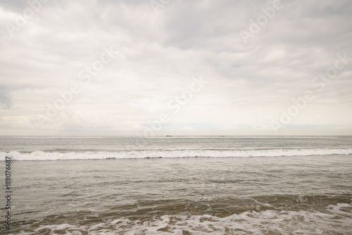 ocean waves on Santa Monica beach in cloudy november day © GCapture