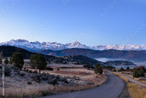 Sunrise over snow capped San Juan Mountains near Ridgway Colorado