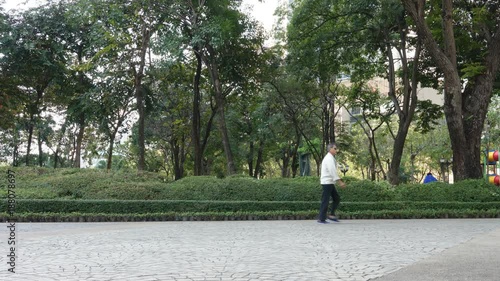People running and jogging in park, time lapse