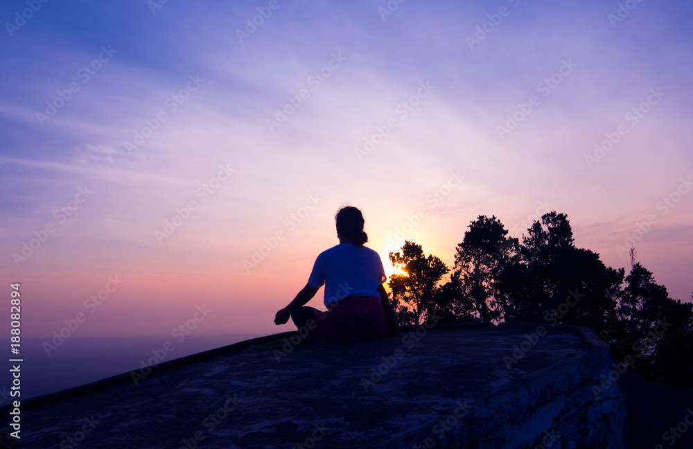 silhouette lady meditation on the hiltop at Tiger cave or Wat Tam Sua Krabi Thailand silhouette lady meditation on the hiltop at Tiger cave or Wat Tam Sua Krabi Thailand
