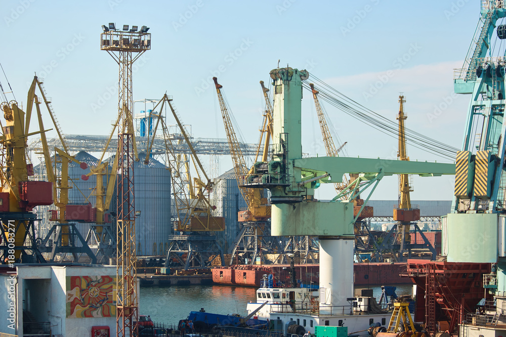 Cargo terminal of international freight industrial port. Sea freight, cranes. Industrial port.