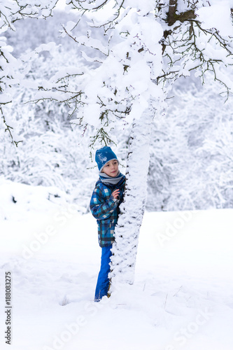 Child in snow in winter