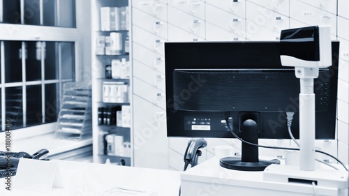 Obraz na plátně Cash desk - computer and monitor in a pharmacy