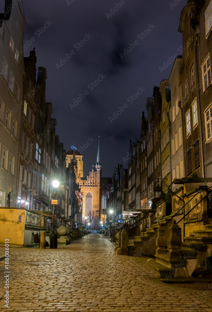 the historic night old town with brick tenement houses is beautifully and romantically illuminated