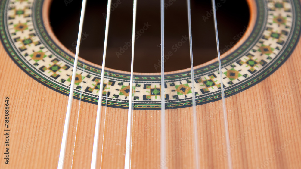 Classical guitar: strings and rosette. Classical guitar: strings and rosette.