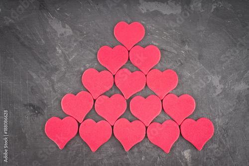 Pink hearts on a gray background. The symbol of the day of lovers. Valentine's Day. Concept February 14. photo