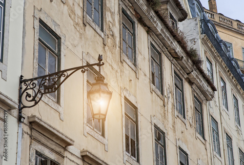 Old street lamp  in Lisbon, detail of an old lighting in the city.