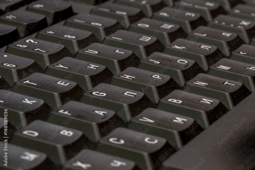 Black keyboard closeup. Keyboard pattern. Horizontal pattern. Vertical pattern.