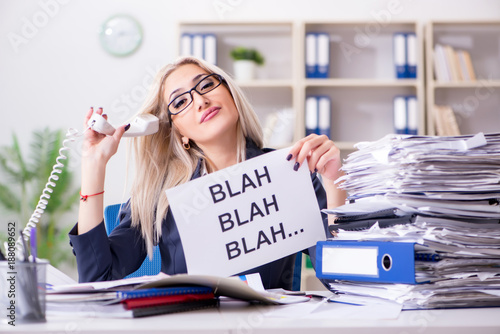 Businesswoman with message in office at desk photo