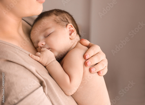 Young mother with cute baby...