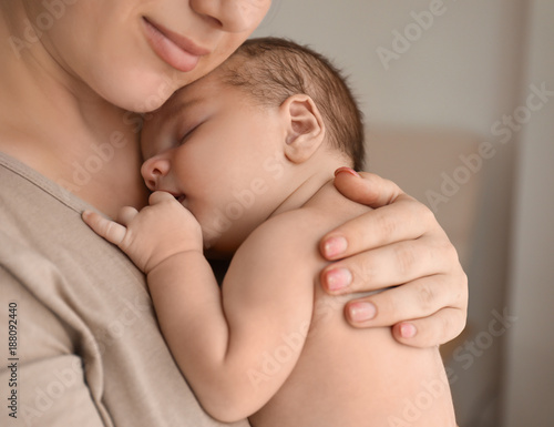 Young mother with cute baby...