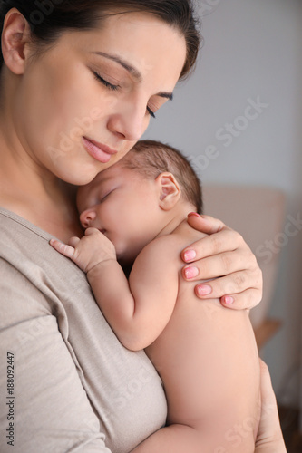 Young mother with cute baby...