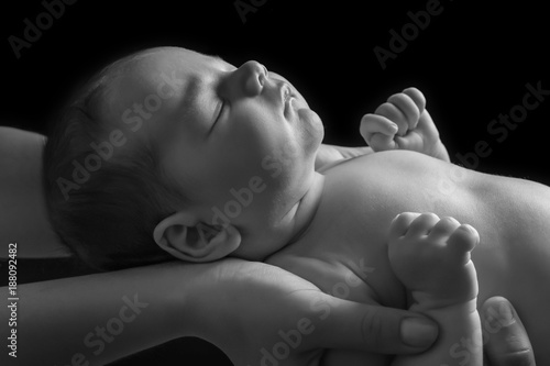 Hands of parents holding cu...