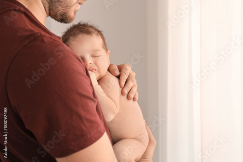Father with cute little bab...