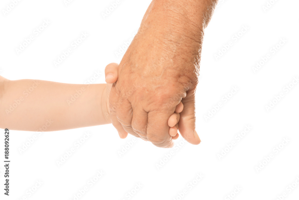 Hands of elderly man and baby on white background Hands of elderly man and baby on white background