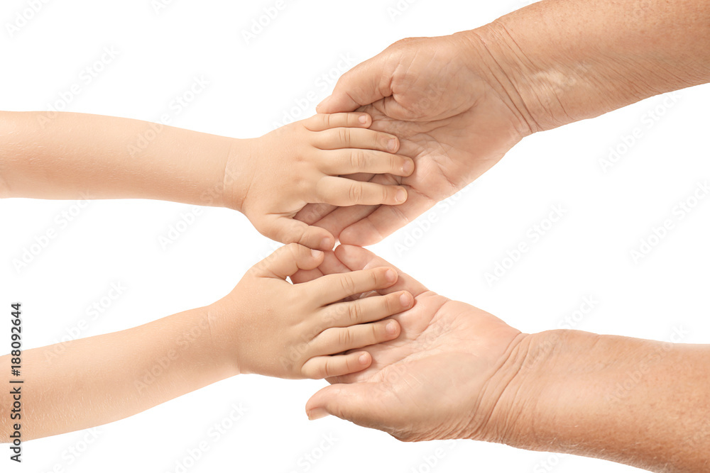 Hands of elderly man and baby on white background