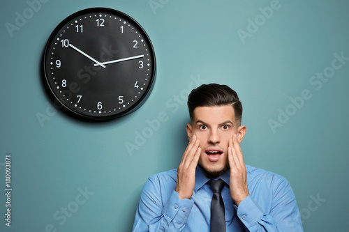 Shocked manager near wall w...