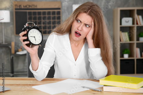 Shocked manager with alarm ...