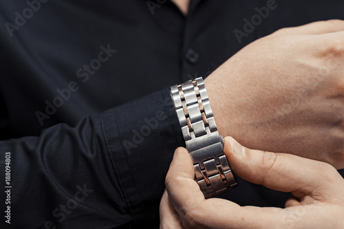 Bracelet from the watch on the arm.
