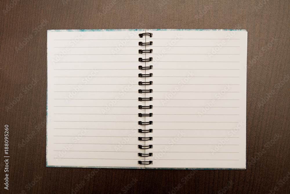 Empty sketch book on a brown background Empty sketch book on a brown background