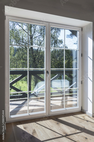 Large wooden window on the summer terrace