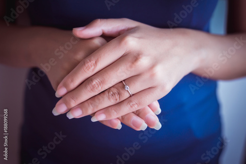 Elegant diamond ring on finger woman © gballgiggs