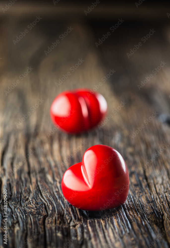 Valentines red heart. One two red heart on wooden table. Wedding or valentine day Valentines red heart. One two red heart on wooden table. Wedding or valentine day