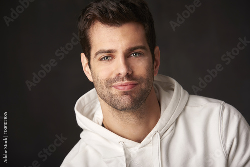 Young man studio portrait with positive vibes