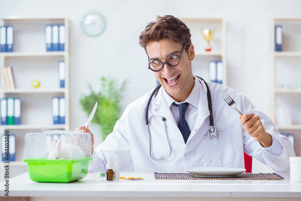 Mad crazy doctor preparing to eat rabbit Mad crazy doctor preparing to eat rabbit