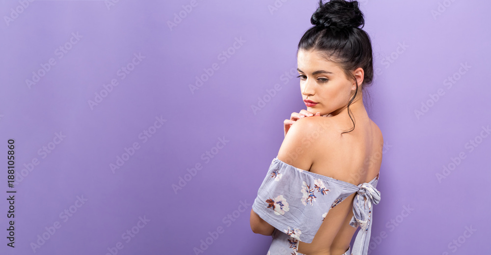 Beautiful young woman on a solid background Stock Photo | Adobe Stock
