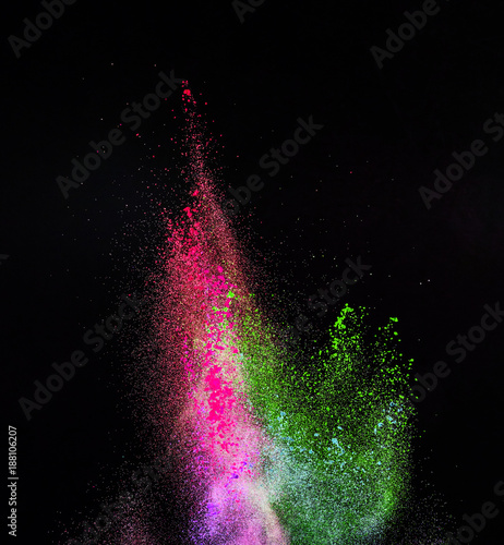 Launched colorful powder, isolated on black background