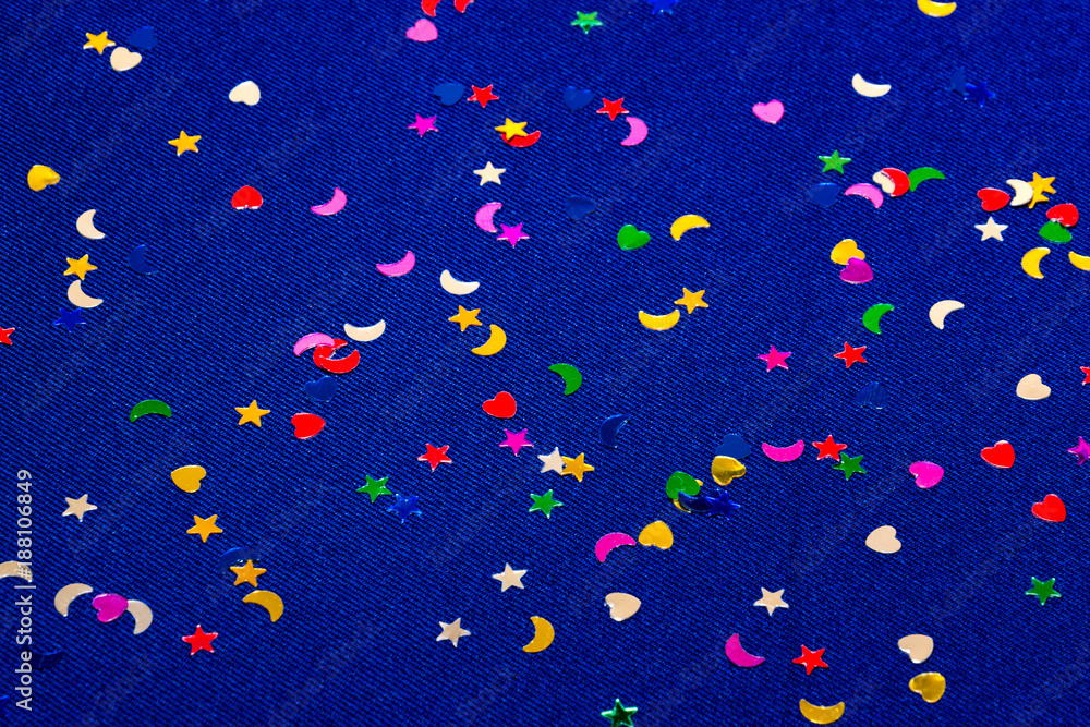 Blue sparkling and glitter background witl little hearts, stars and moons. Top view. Blue sparkling and glitter background witl little hearts, stars and moons. Top view.