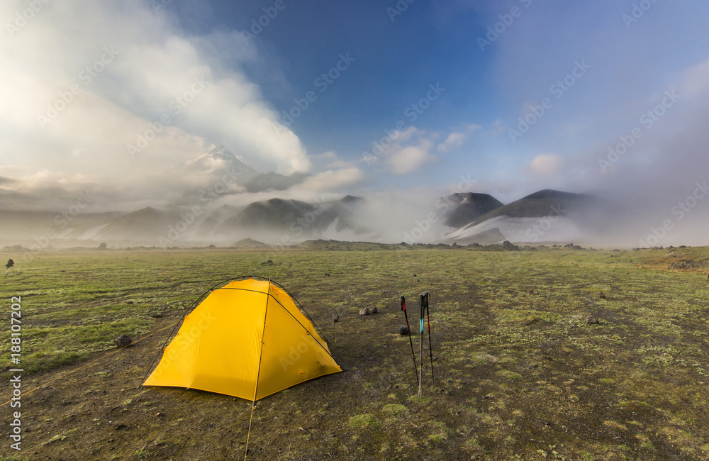 yellow tent near volcanoes of Kamchatka