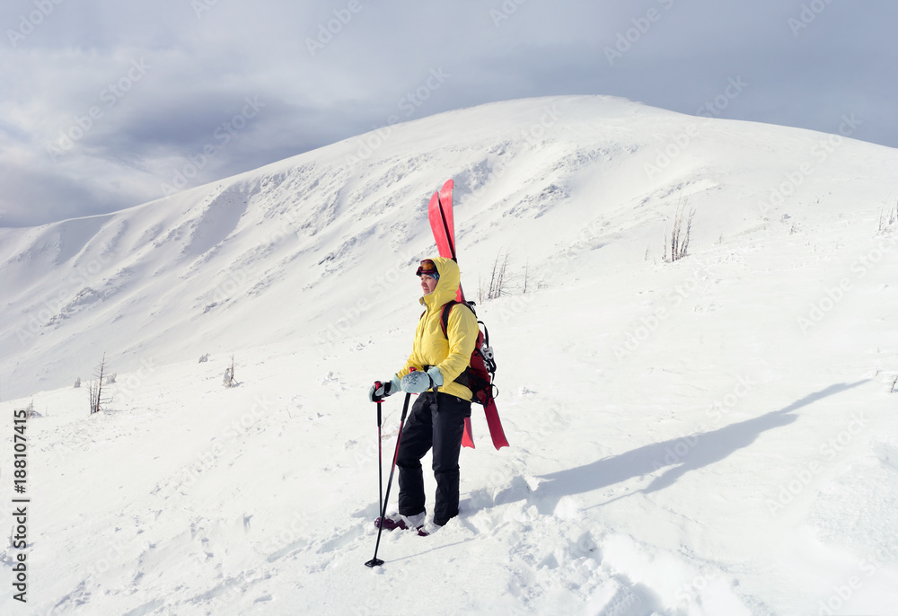 Alpine touring skier in winter mountain